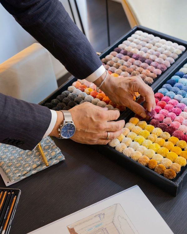 Hands choosing colour samples