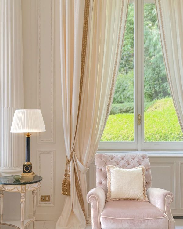 Armchair beside a window onto a garden